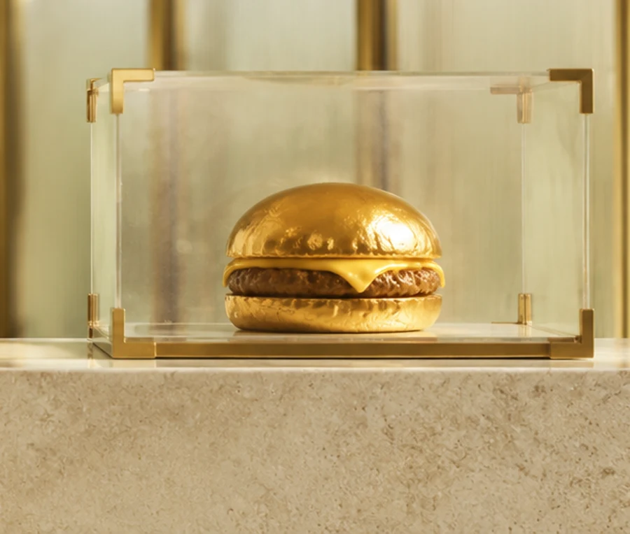 The golden cheemsburger sealed in its crystal display case